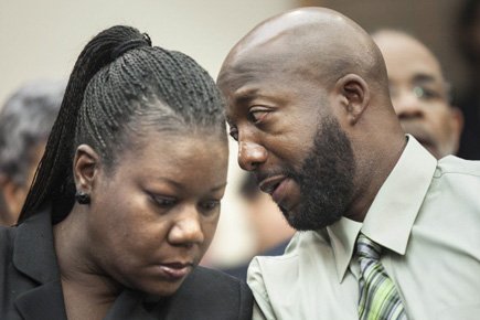 Les parents de Trayvon Martin, Sybrina Fulton et Tracy Martin,... (Photo: AFP)