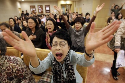 «Nous allons prier Dieu afin que le concert... (Photo Lee Jin-man, AFP)