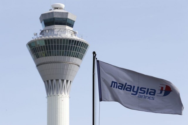 L'action de Malaysia Airlines plonge à la Bourse de Kuala Lumpur Un avion de la compagnie aérienne malaisienne parti... (PHOTO ARCHIVES OLIVIA HARRIS, REUTERS)