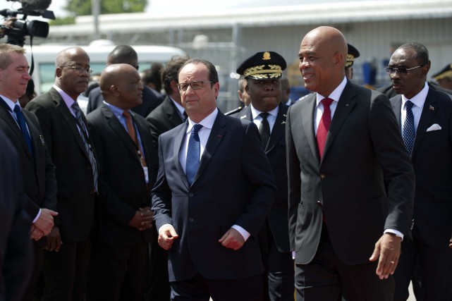 Le président Martelly a déclaré à son homologue... (PHOTO HECTOR RETAMAL, AFP)