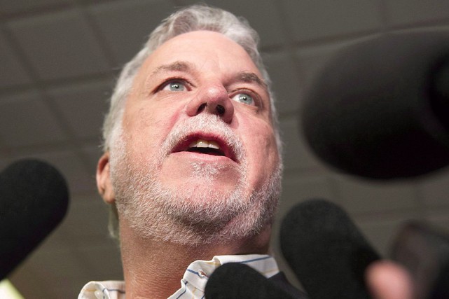 Philippe Couillard Quebec Premier Philippe Couillard responds to reporters questions... (Jacques Boissinot, Archives La Presse Canadienne)