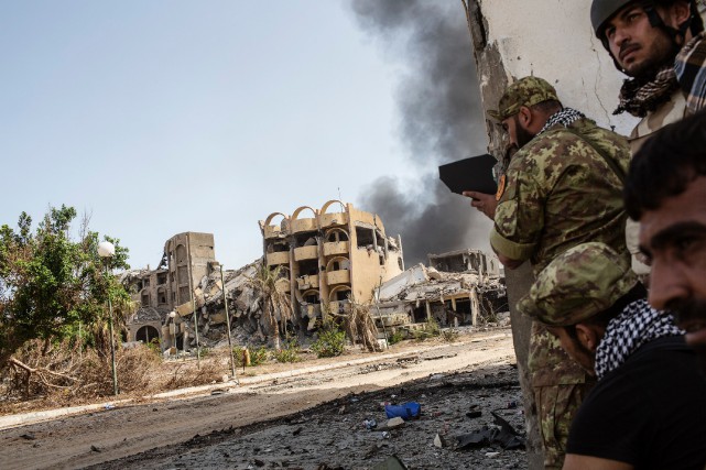 TOPSHOT-LIBYA-CONFLICT Les forces libyennes progouvernementales, dont huit soldats ont... (photo AFP)