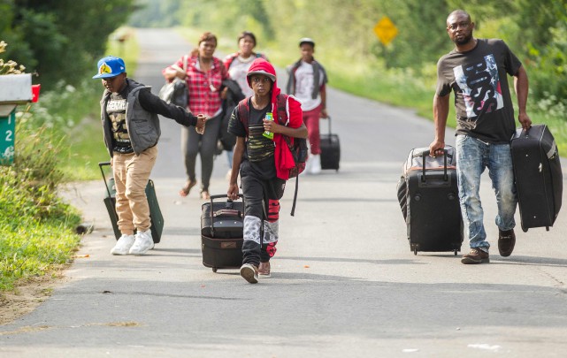 AFP_R83N1 L'arrivée massive de demandeurs du statut de réfugié... (AFP)