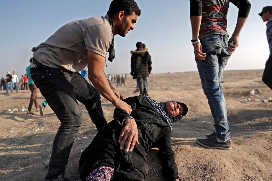 "Spingono i civili - donne, bambini -... (Foto Thomas Coex, Agence France-Presse)